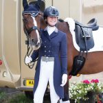 Rider smiling with horse at championships