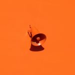 an orange speaker amplifying the importance of being a multi-media brand