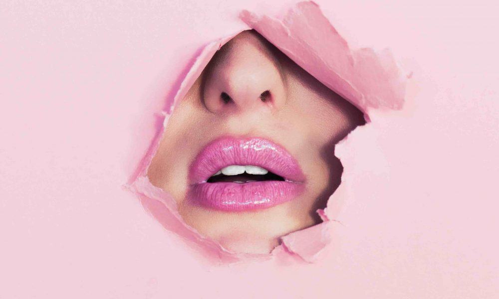 Glossy Pink Lipstick On Beauty Model