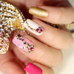 woman showing nail trends with jewellery